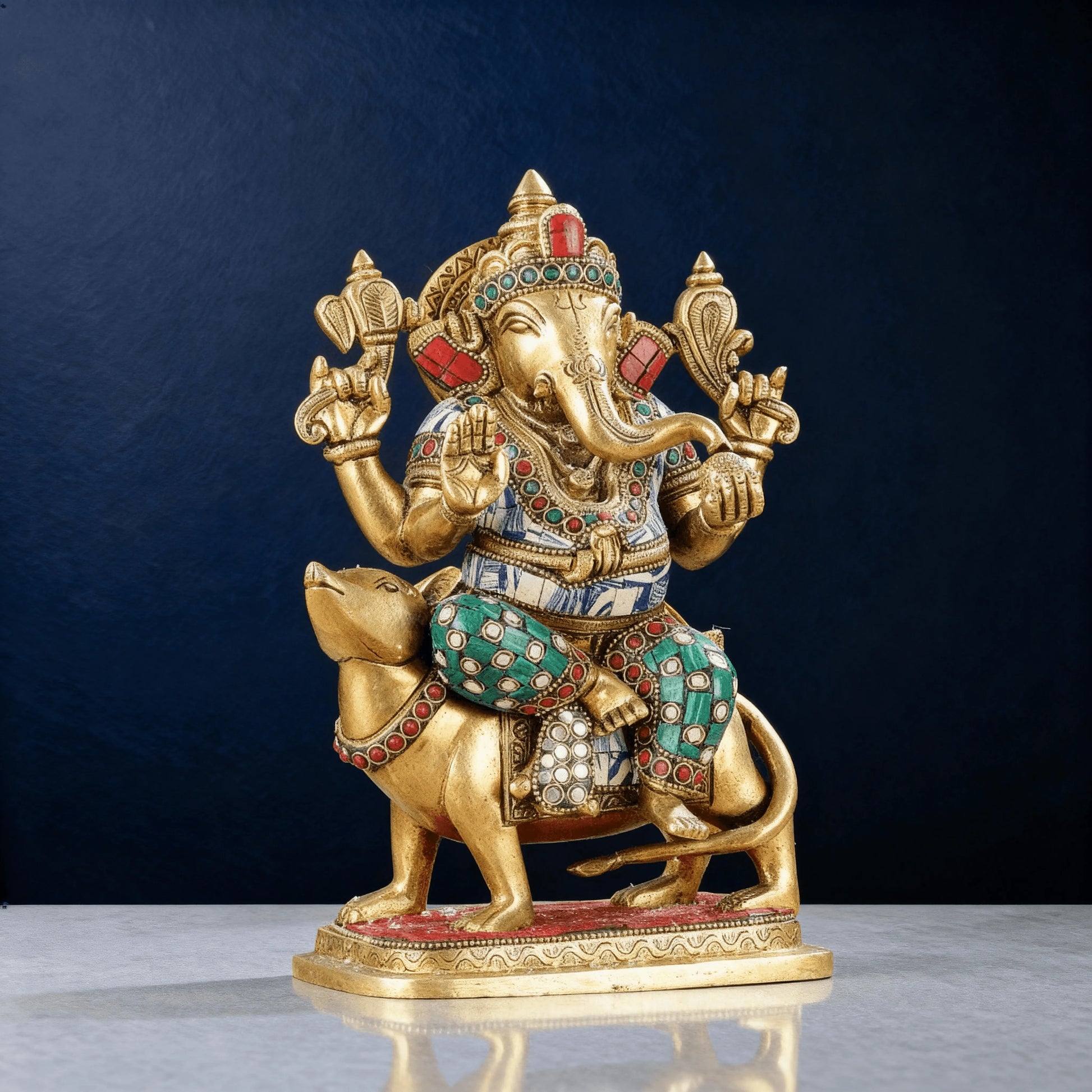 front view brass ganesha idol seated on mouse