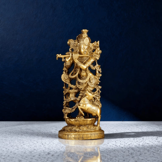 Pure brass Krishna idol with cow – handcrafted statue on a carved base, polished gold finish, minimal luxury decor piece