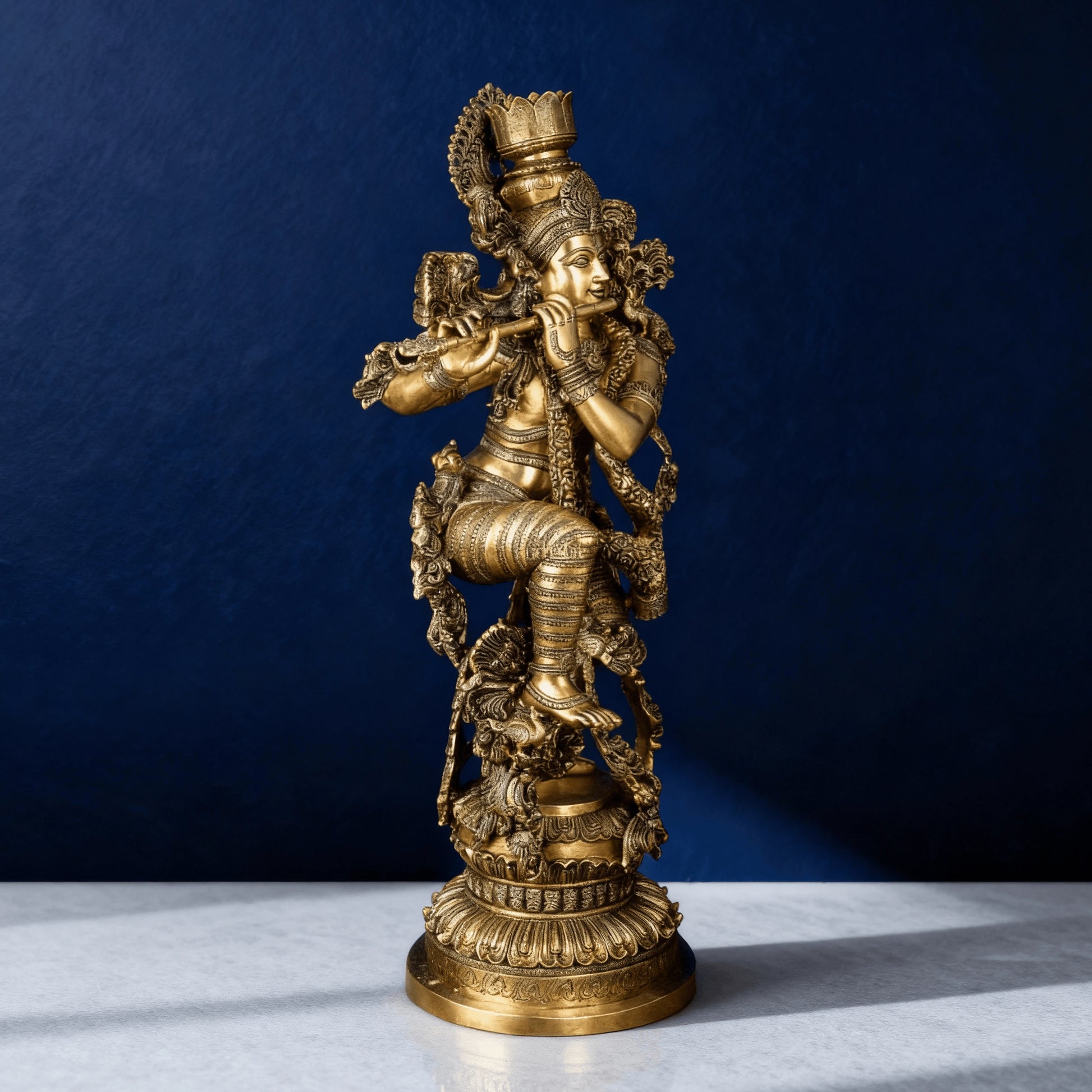 Pure brass Krishna idol with detailed craftsmanship and flute pose for home decor