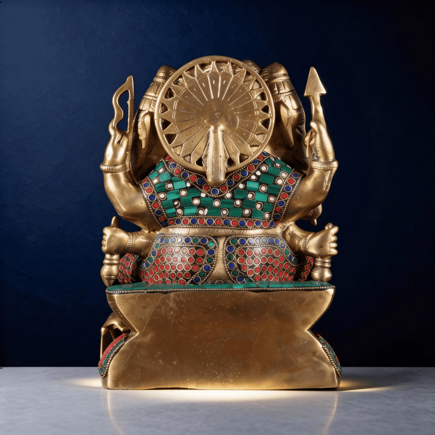 back view of brass ganesha statue with stone inlay work