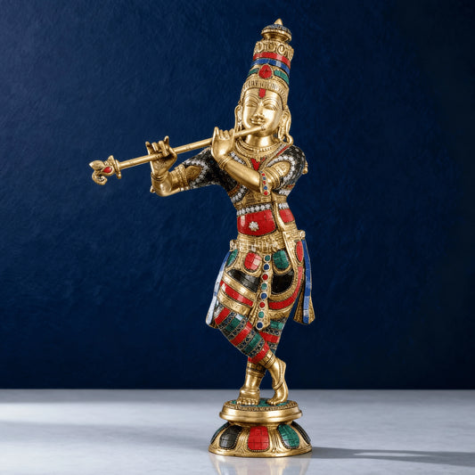 Front-facing brass Krishna statue with multi-color stonework details