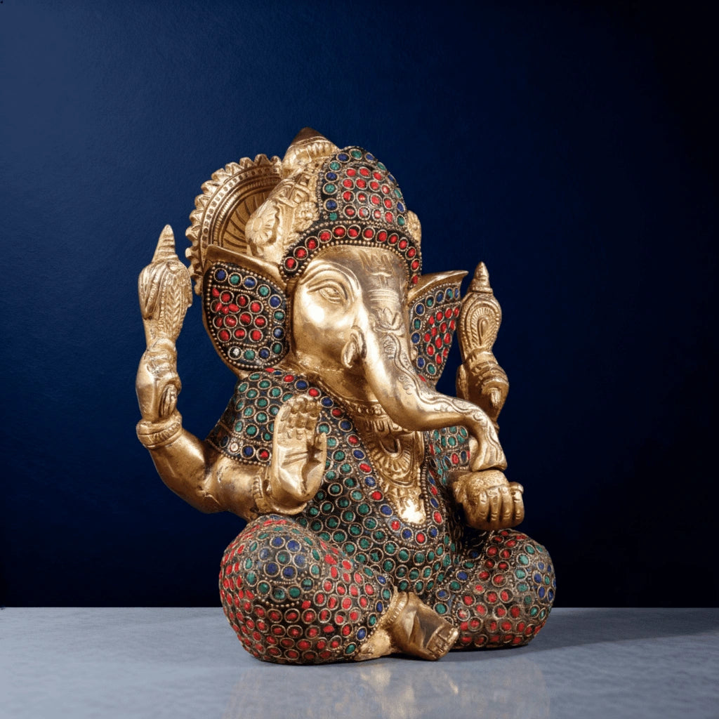 Side-angle close-up of meenakari brass Ganesha statue featuring detailed stone inlay and premium craftsmanship