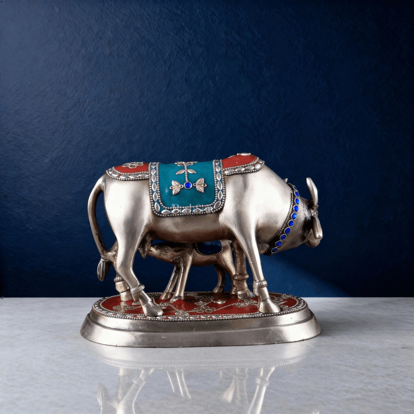 Back view of decorative brass cow and calf idol with colorful enamel saddle and anklets – Indian vastu home decor