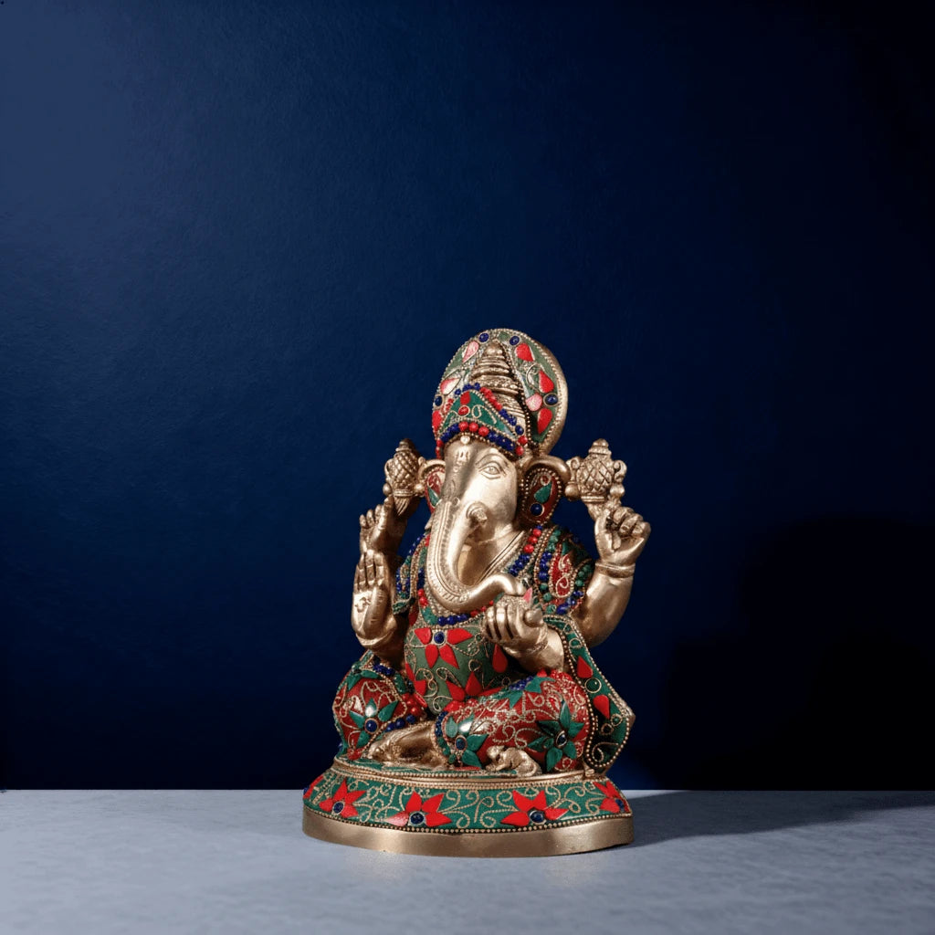 Side-angle shot of premium meenakari brass Ganesha murti with intricate hand-painted detailing