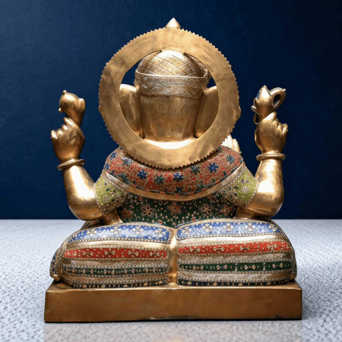 back view brass ganesha idol showing detailed halo and enamel craftsmanship