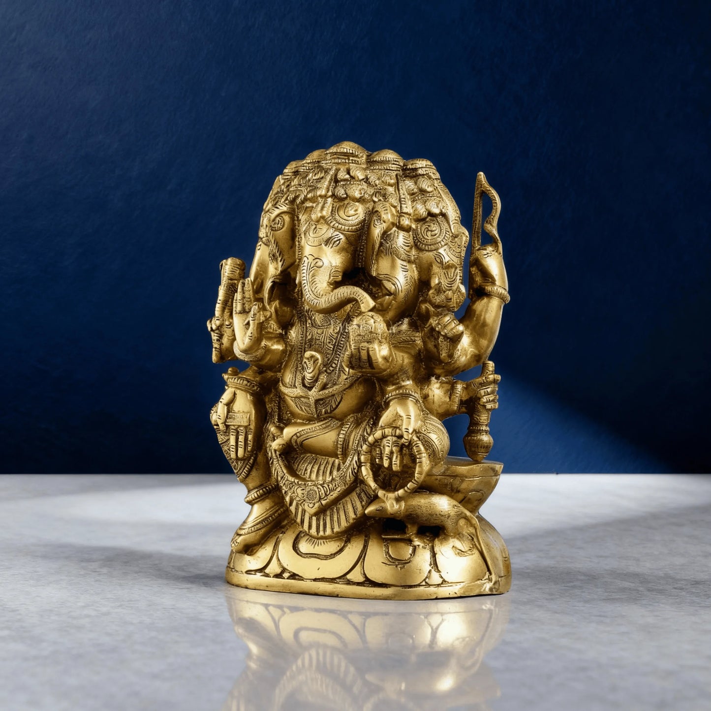 angled view brass ganesha murti for pooja and decor