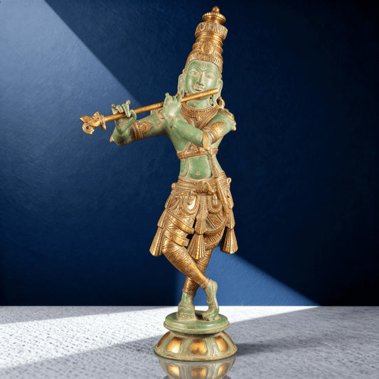 Side angle of handcrafted brass Krishna statue with green patina