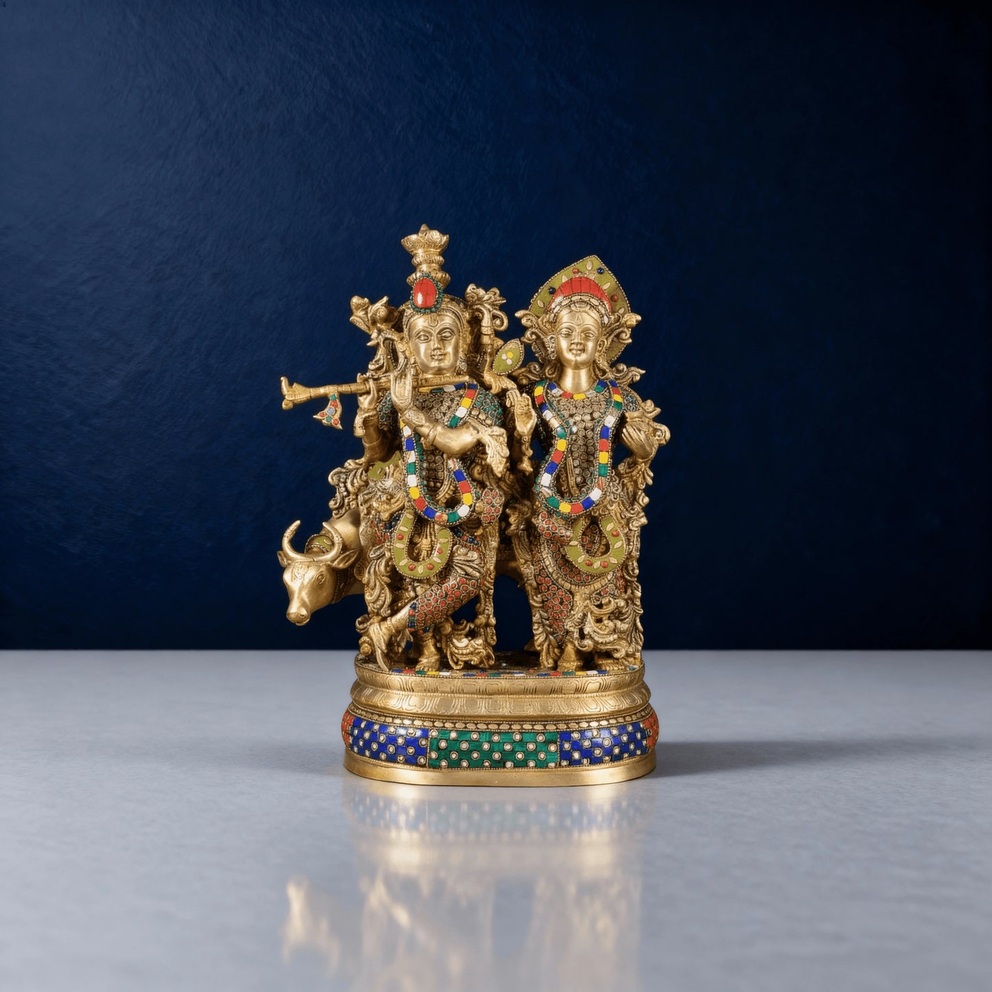Brass Radha Krishna idol with colorful meenakari work and cow – traditional Hindu spiritual decor