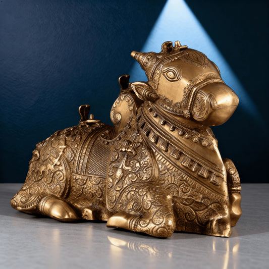 Intricately carved brass Nandi statue close-up with detailed patterns