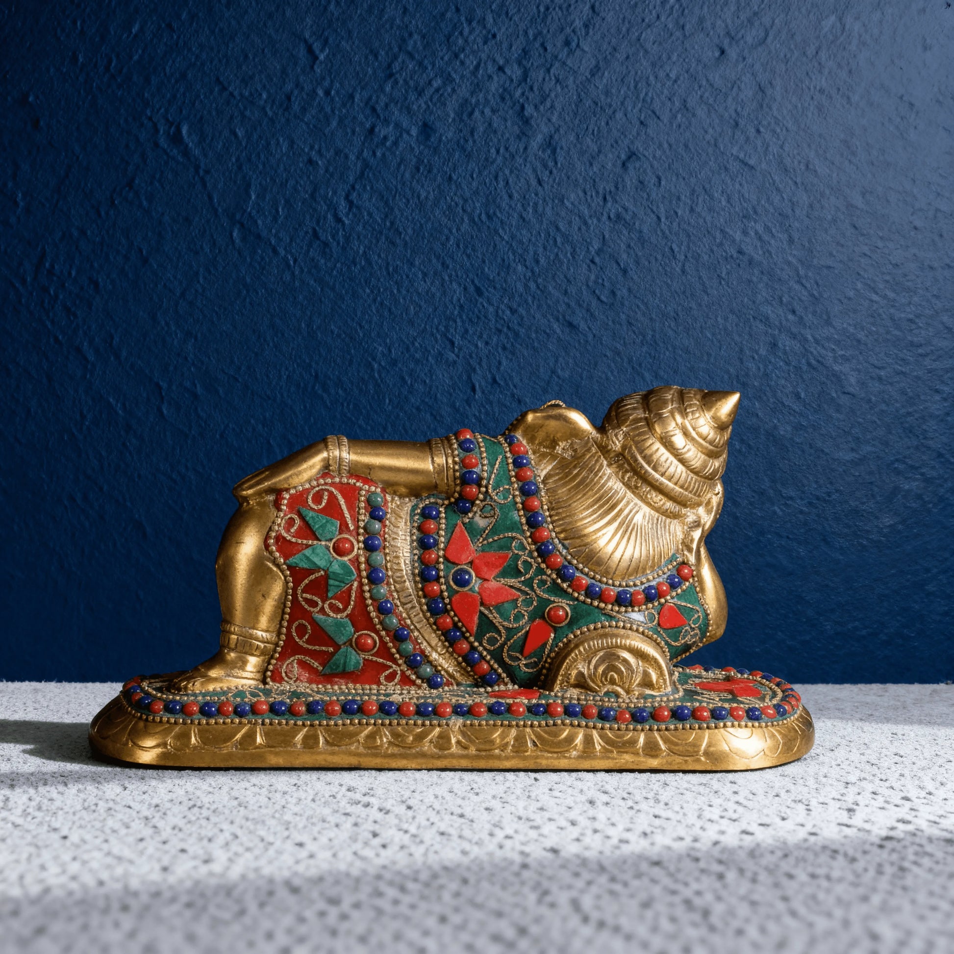 back view reclining brass ganesha idol with stone detailing