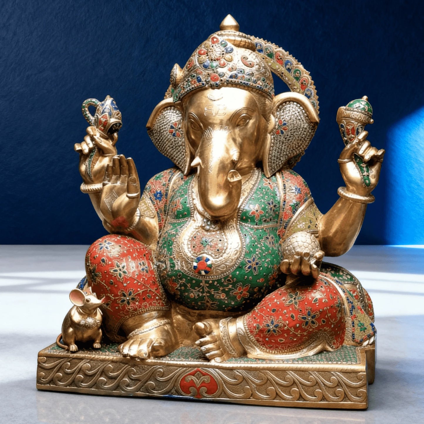 front angle brass ganesha statue with red green enamel work and mouse vahana