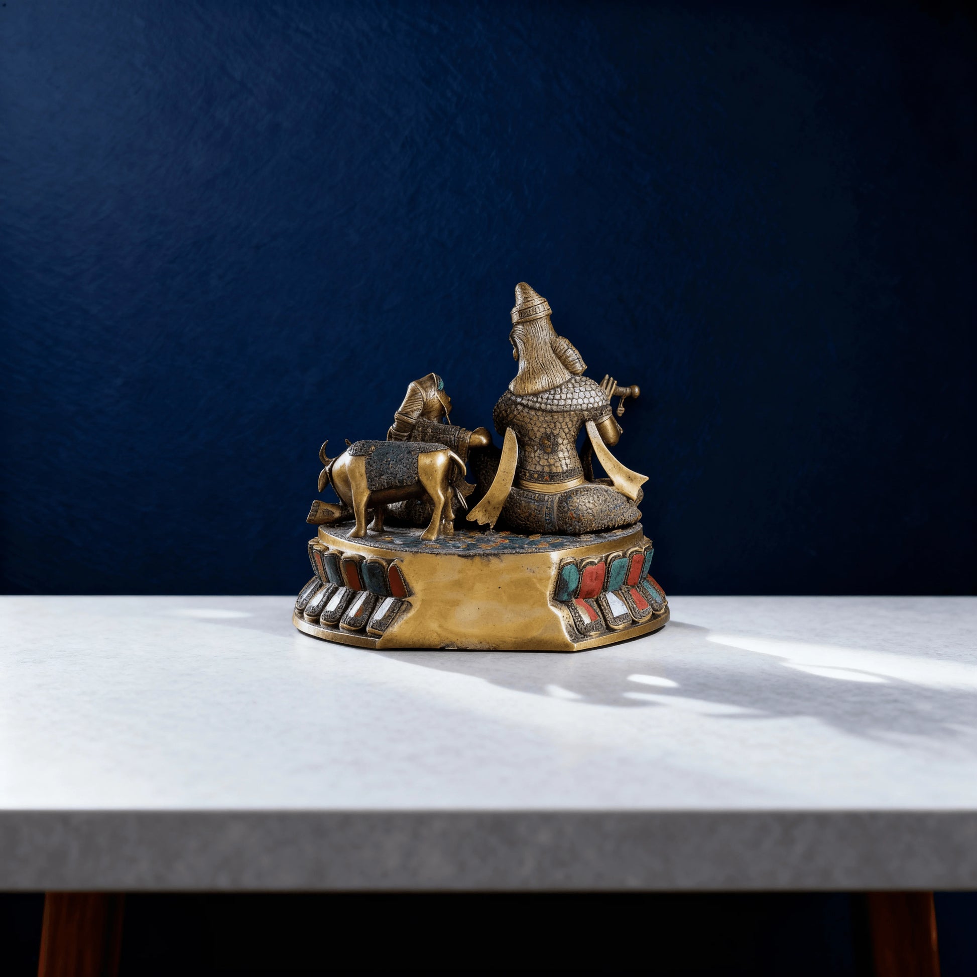Rear view of solid brass Radha Krishna sculpture with detailed cow and base, traditional metal art