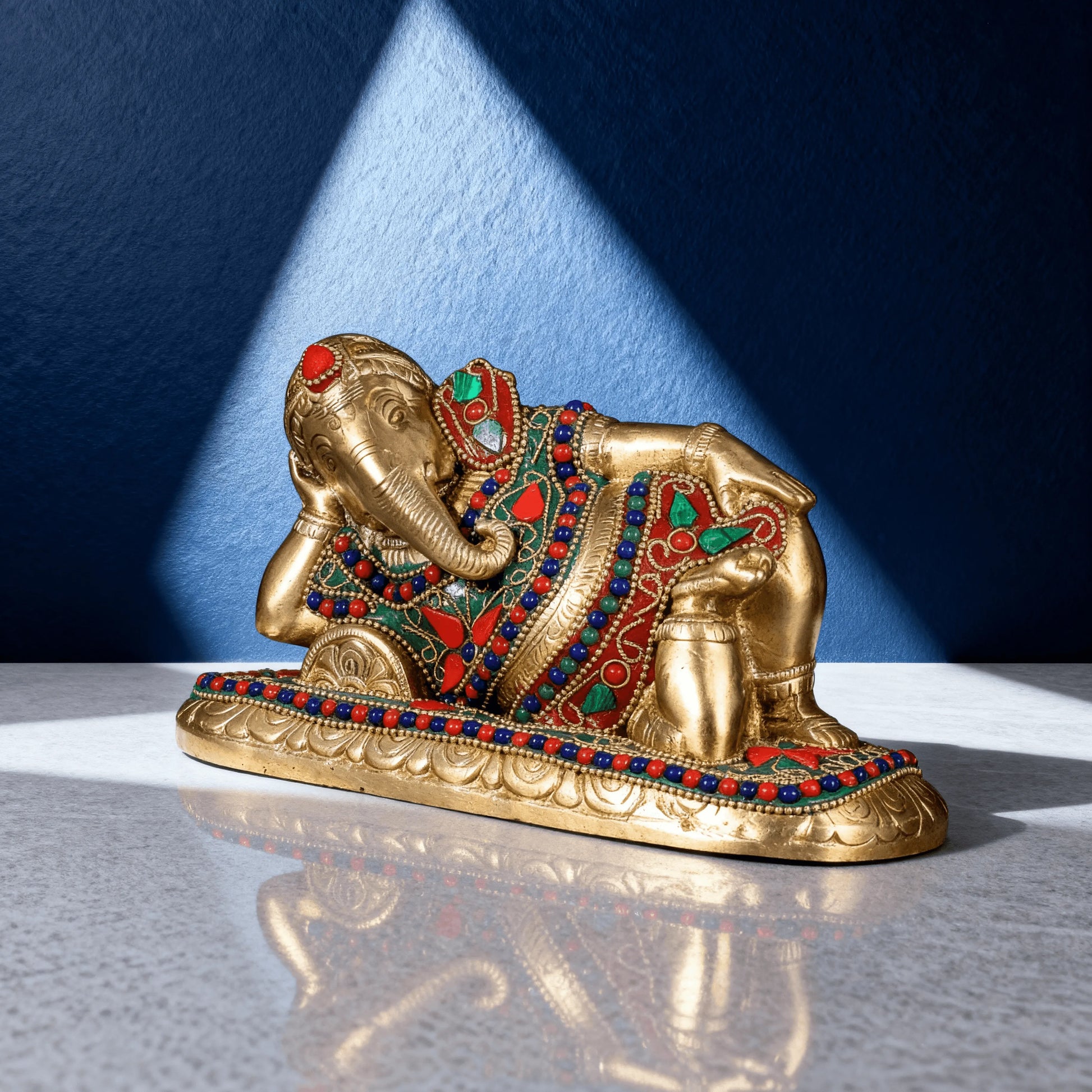angled view resting ganesha brass statue for home temple