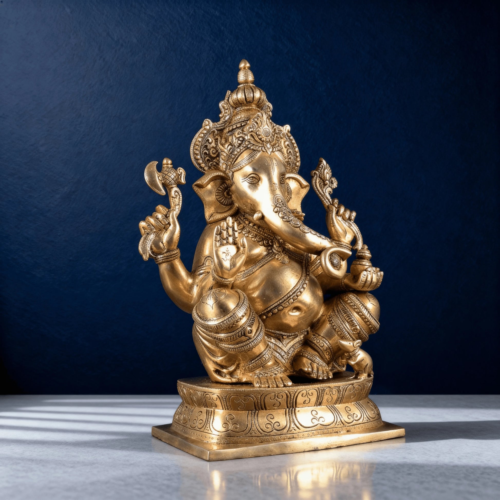 brass ganesha statue side angle traditional design