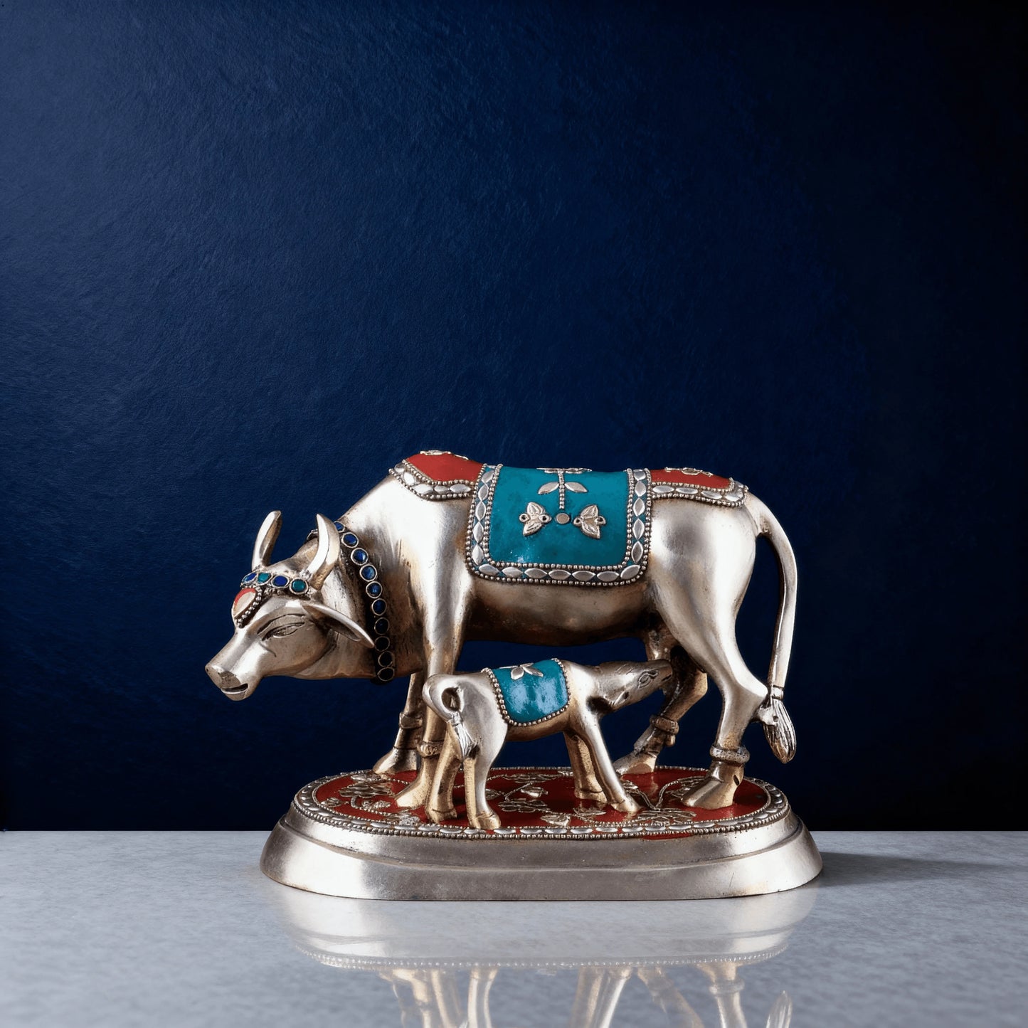 Brass cow and calf idol with red and turquoise enamel detailing on marble base – traditional Indian home decor statue