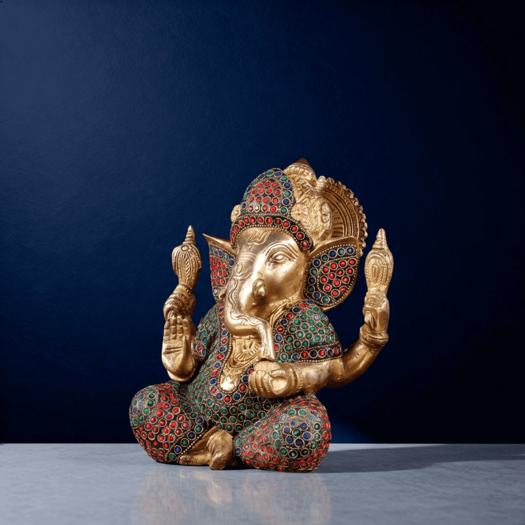 Meenakari brass Ganesha idol with red-green stonework and intricate hand-carved detailing for home decor