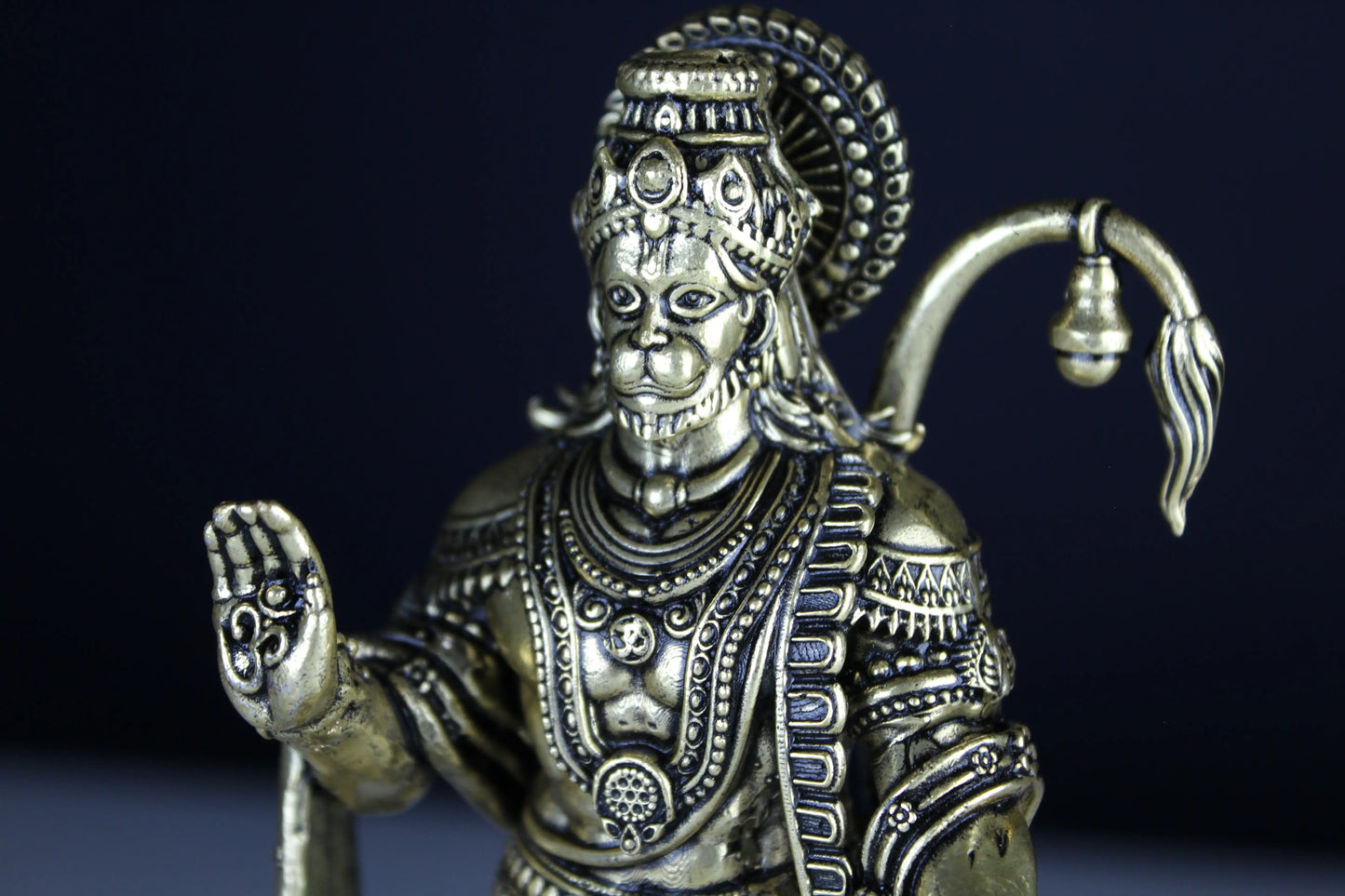 Decorative figurine of Hamunam with intricate details on a dark background