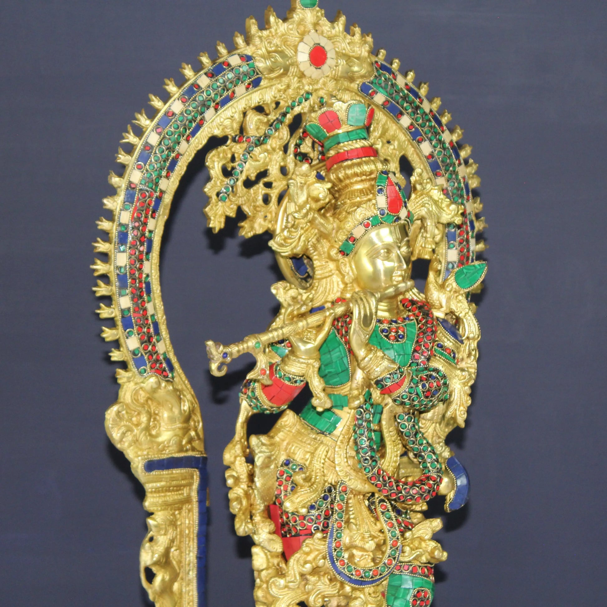 Krishna Gold colour statue with stone work