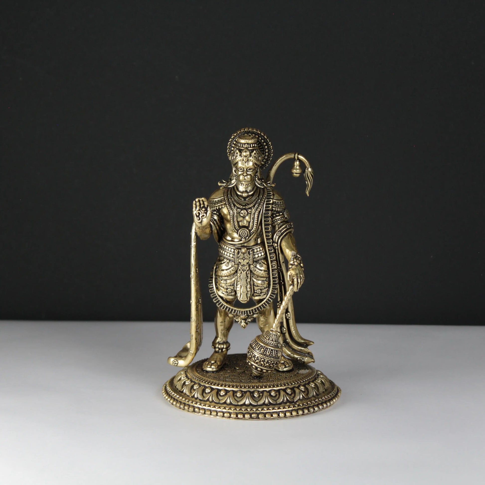 Decorative Golden Hanuman statue on a black and white background