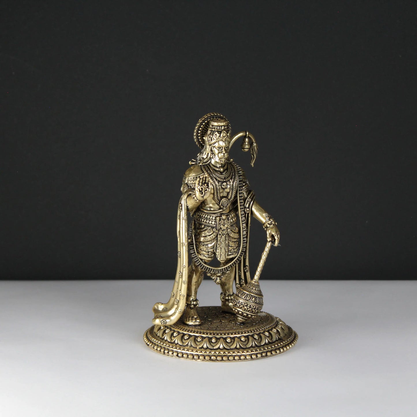 brass Hanuman statue black and white background