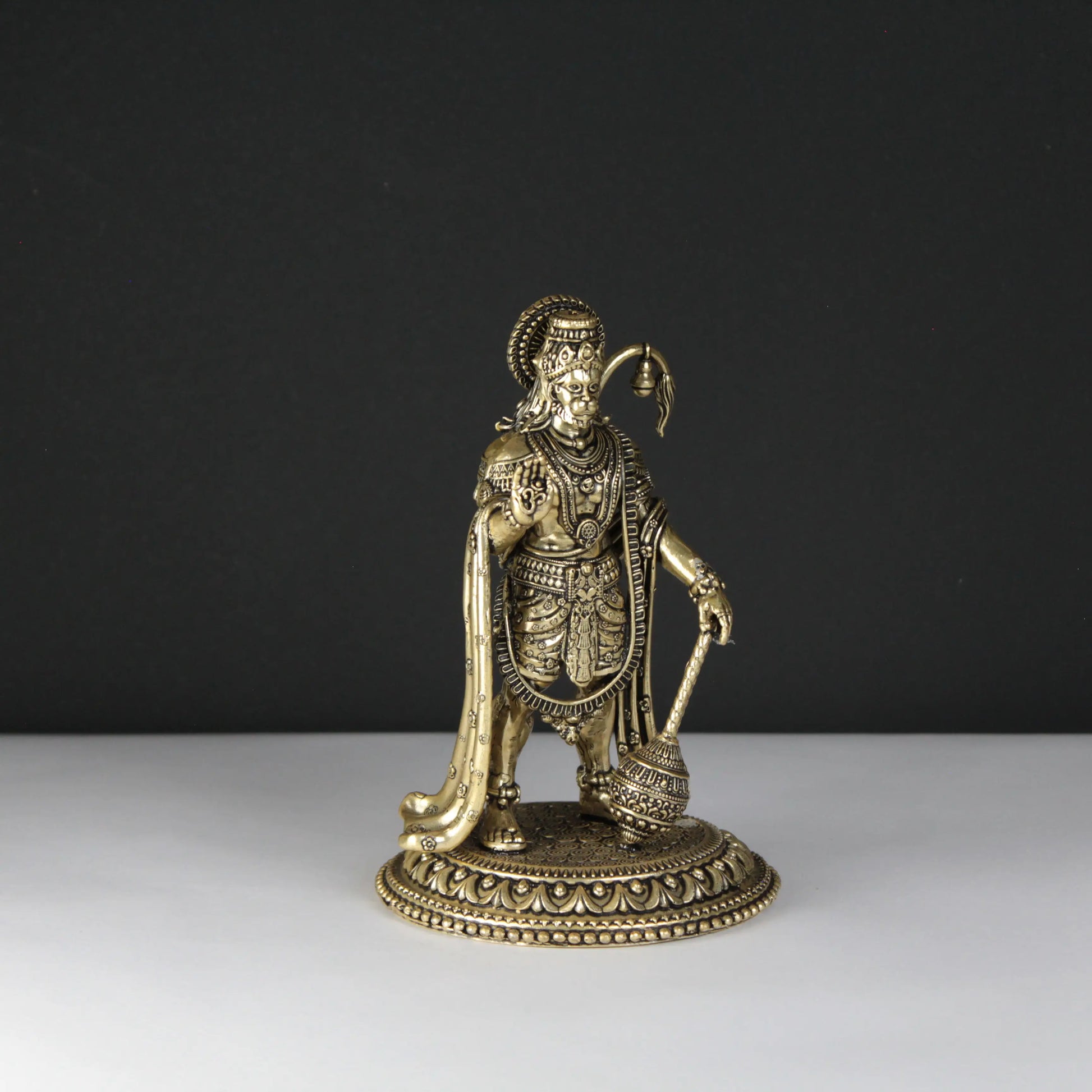 brass Hanuman statue black and white background