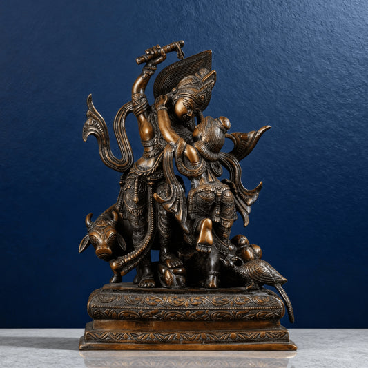 High-quality brown brass Krishna lifting Govardhan idol on carved base, detailed textures and motifs, handcrafted Indian artwork.
