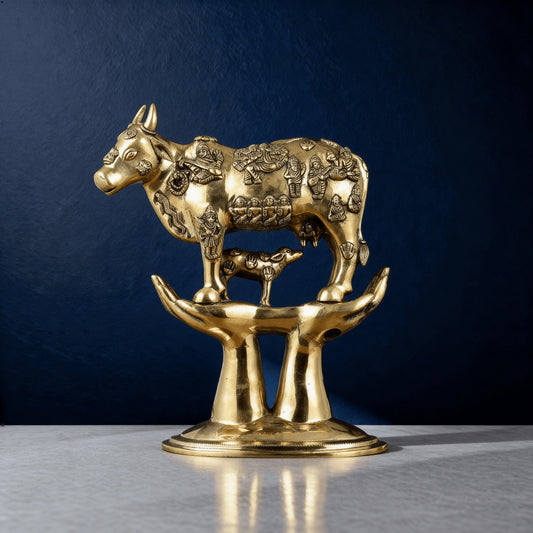 Close-up of sacred Kamadhenu cow statue with miniature gods and calf – handcrafted brass home temple decor