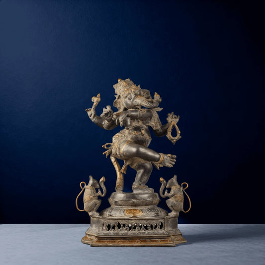 Front-facing silver-toned Ganesha dancing statue in dynamic posture with dual mouse companions