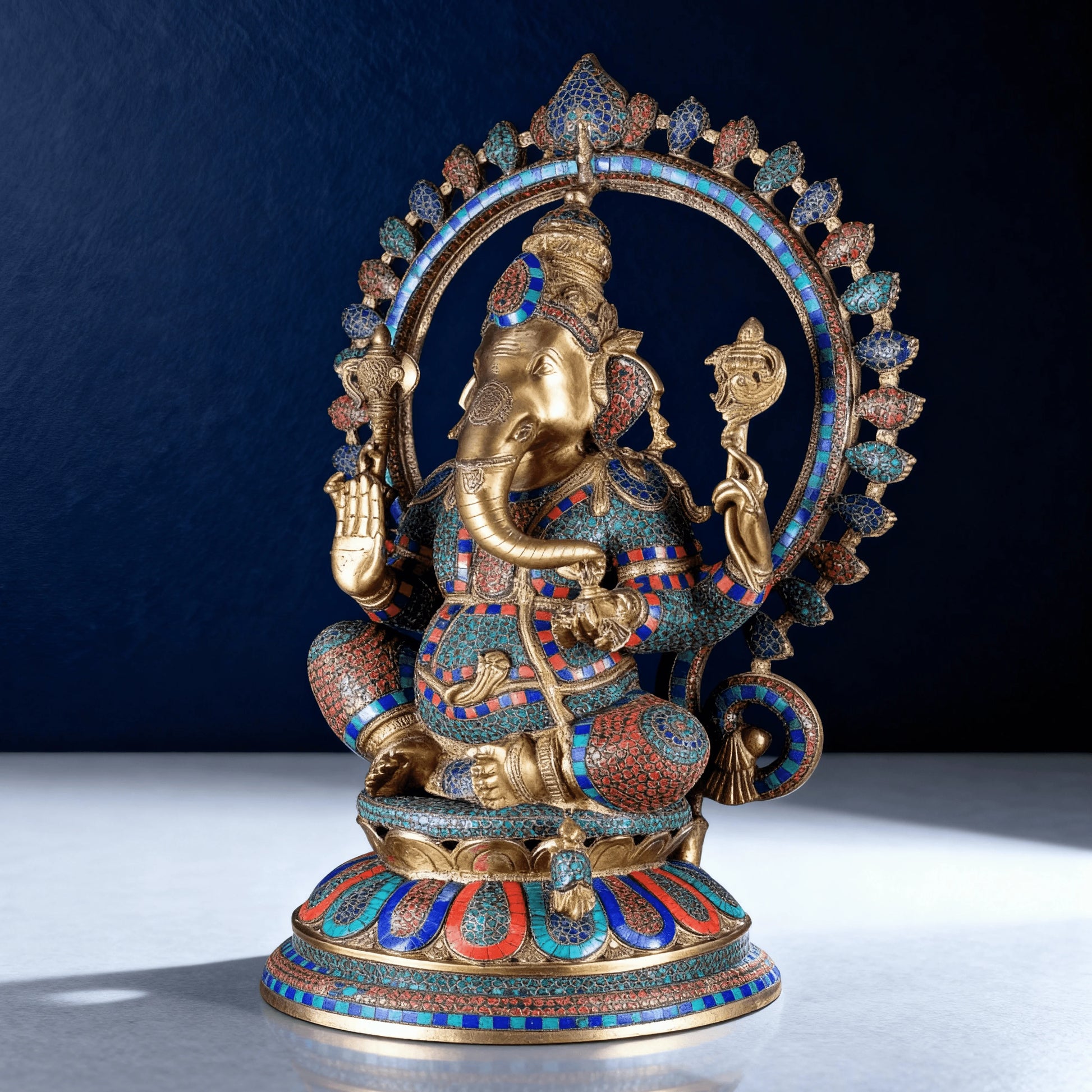 Premium pure brass Ganesha idol with multicolor meenakari design and ornate arch captured in studio lighting