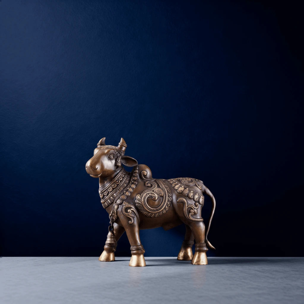 antique style brass nandi sculpture with ornate carvings and temple-inspired detailing