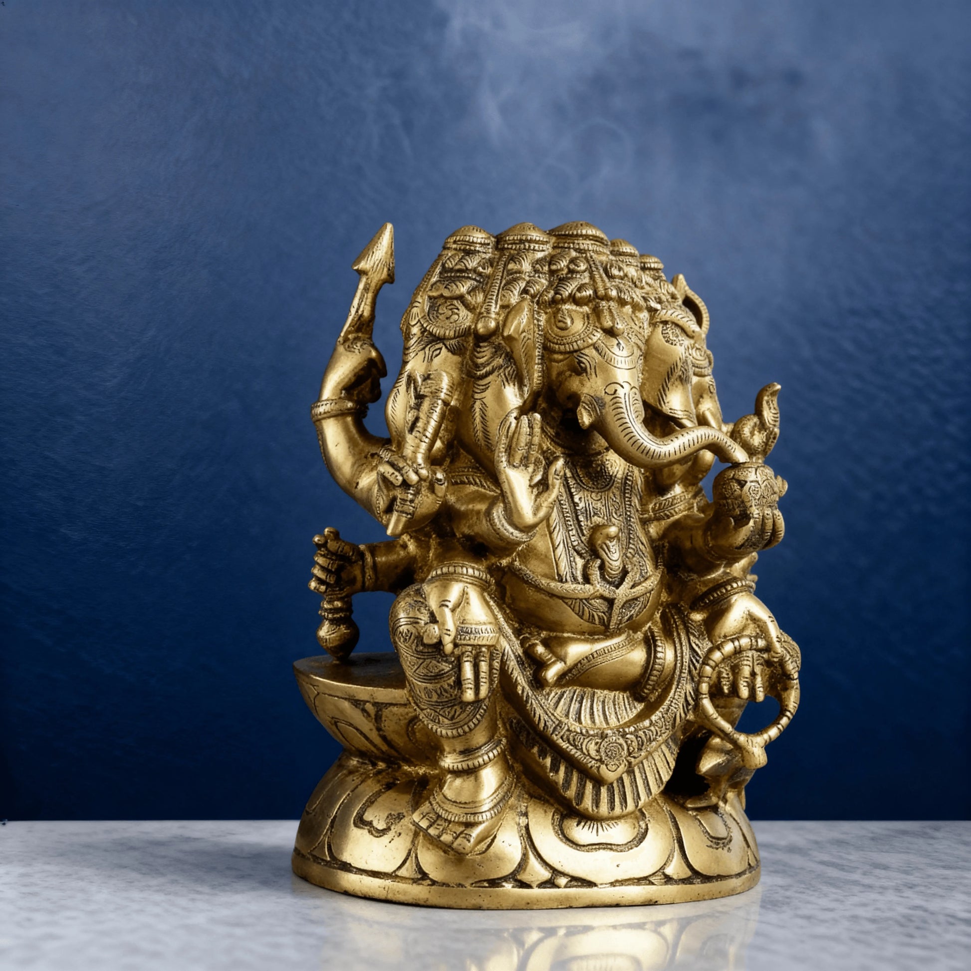 side angle brass ganesha statue with detailed carving