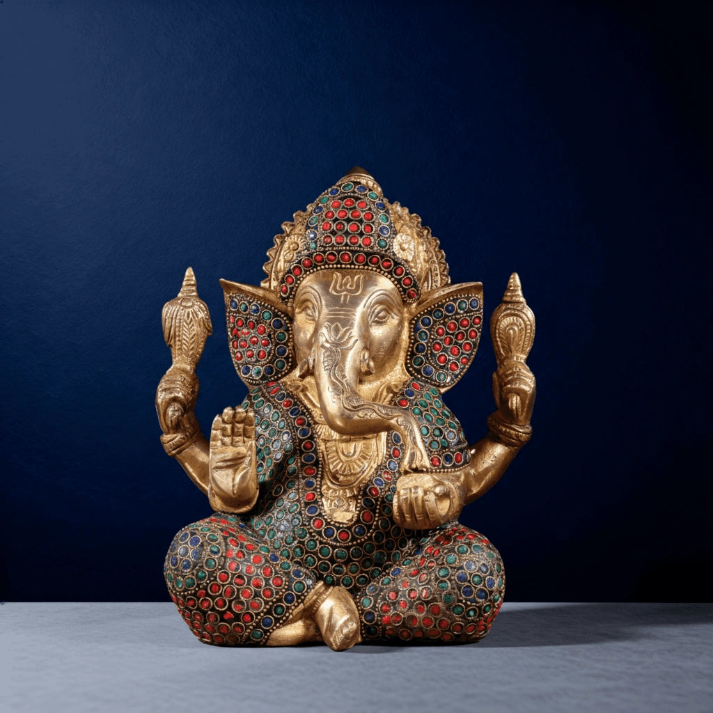 Front view of handcrafted meenakari brass Ganesha murti with vibrant stone inlay and fine ornamental detailing