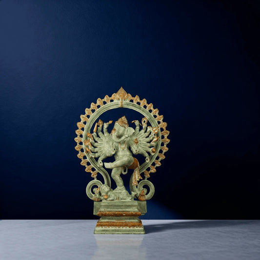 Front-facing green antique-style Ganesha idol with ten arms in dance pose surrounded by decorative arch