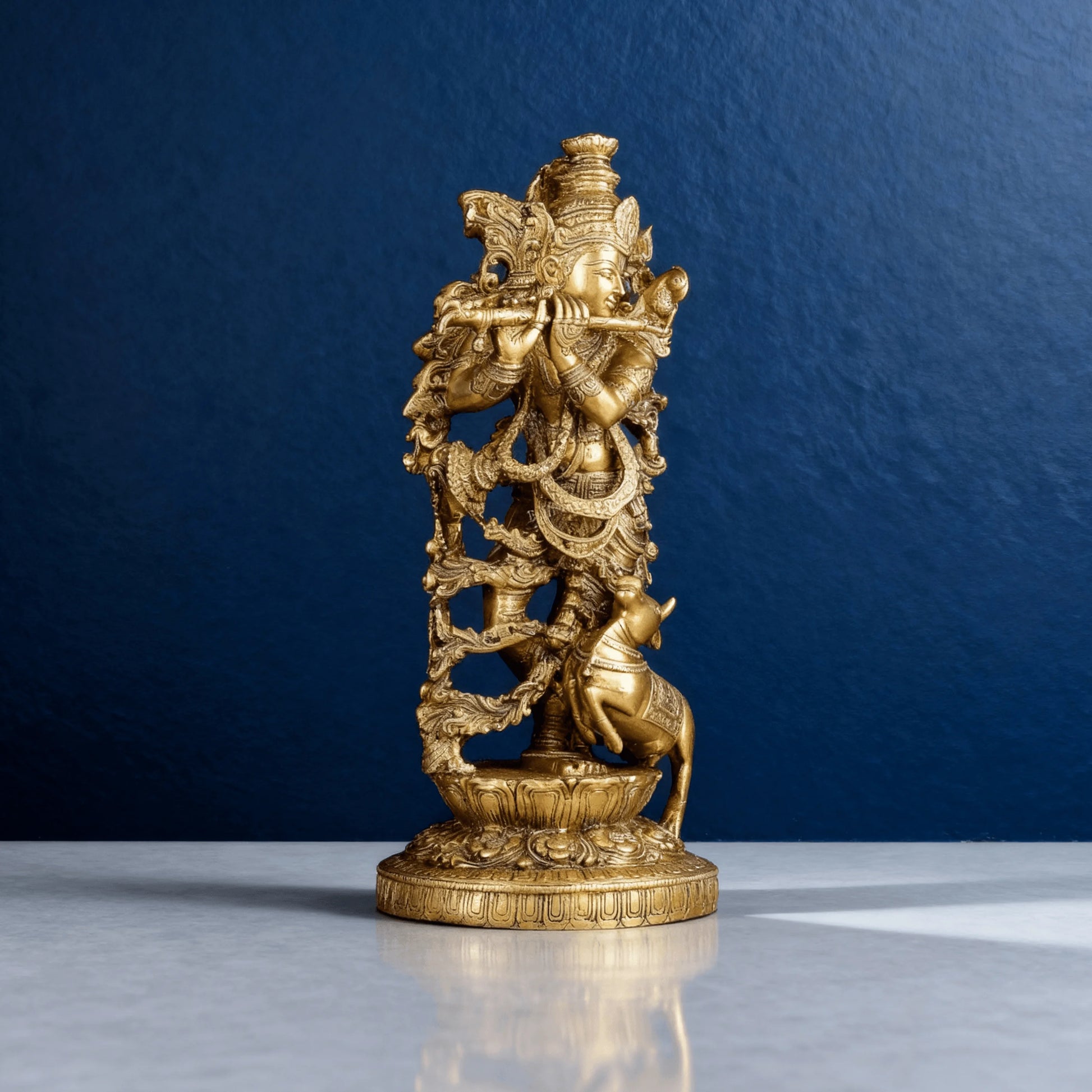 Angled view of solid brass Krishna with cow sculpture, showcasing intricate craftsmanship and premium finish