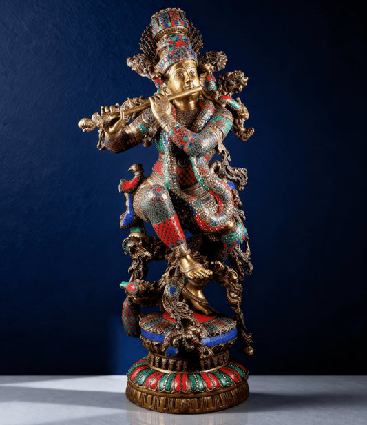 Front close view of multicolor stone-inlaid brass Krishna idol