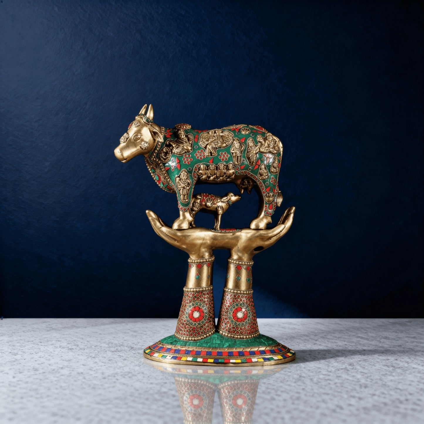 Handcrafted brass Kamadhenu cow murti with miniature deities and calf – vastu decor for pooja room or temple
