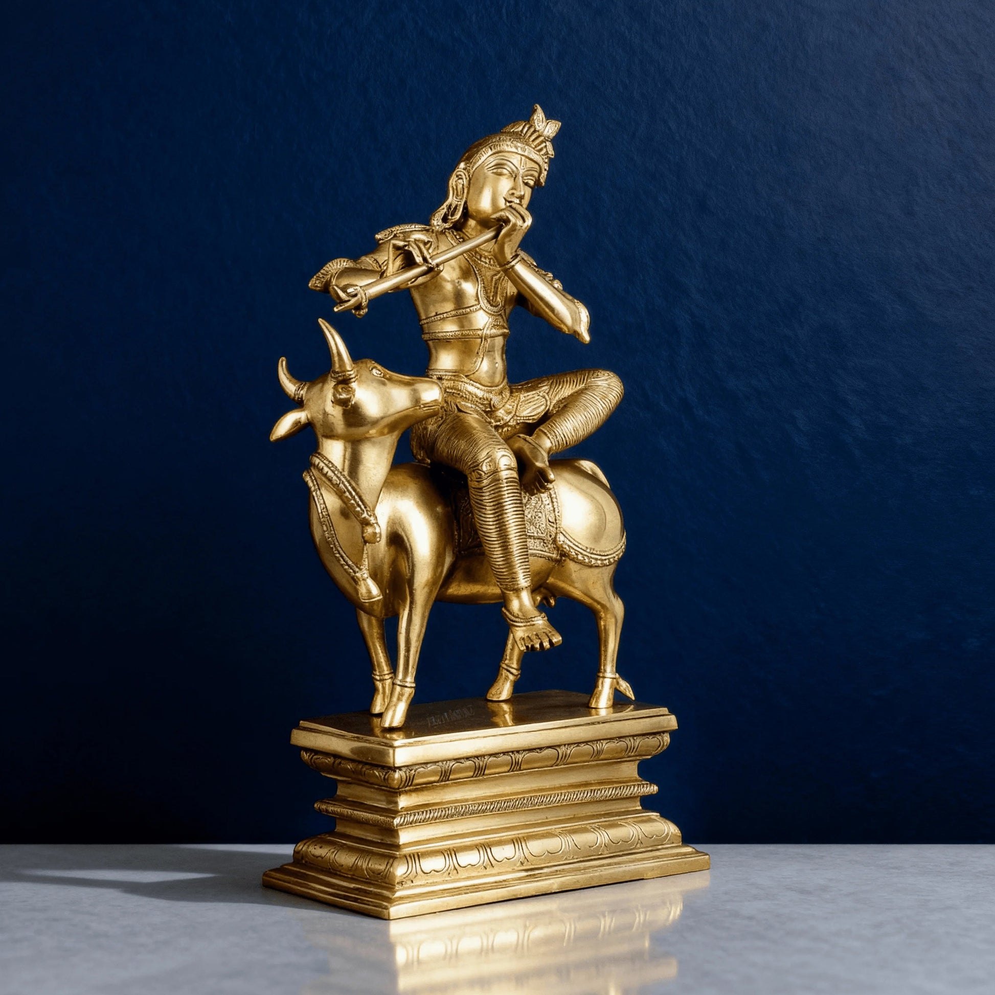 Side angle of Krishna with cow sculpture, handcrafted in solid brass with classic posture and fluted base design