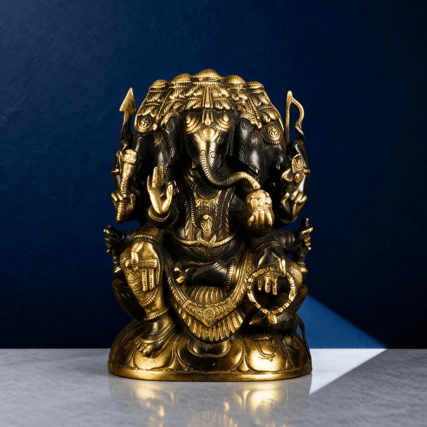 black and gold brass ganesha statue front view