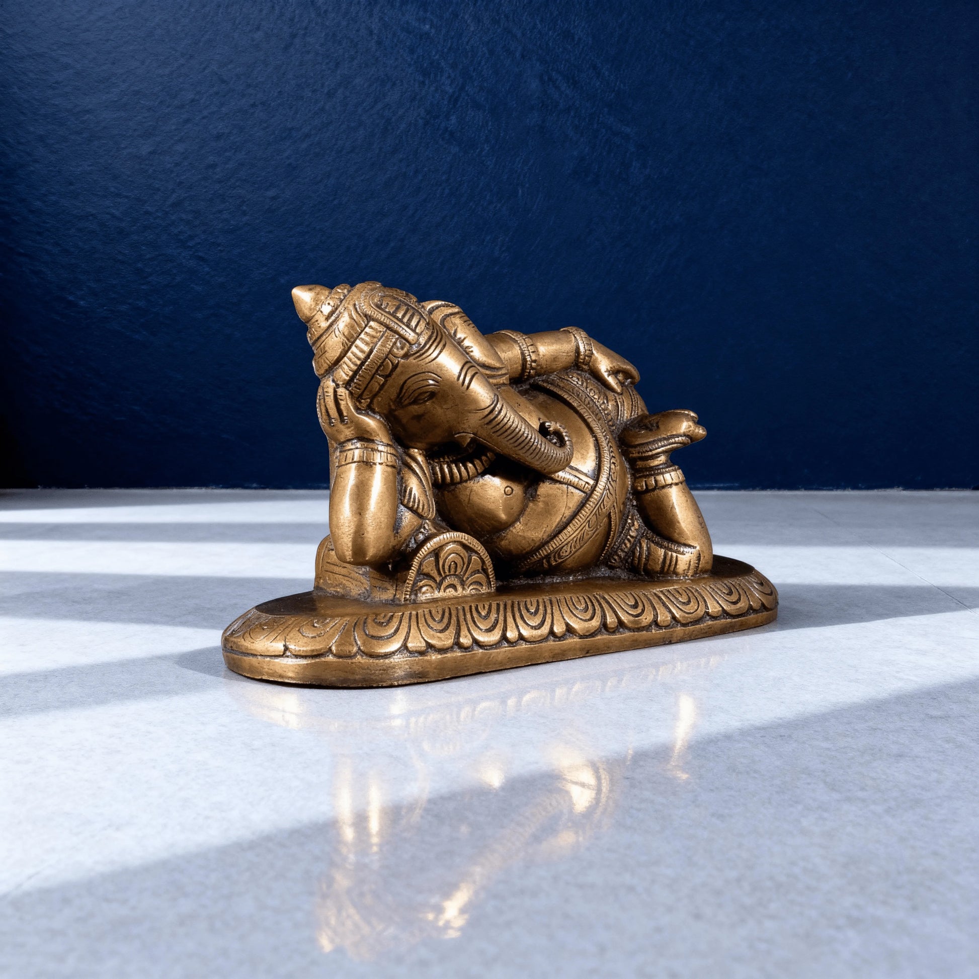 reclining brass ganesha statue side view handcrafted idol